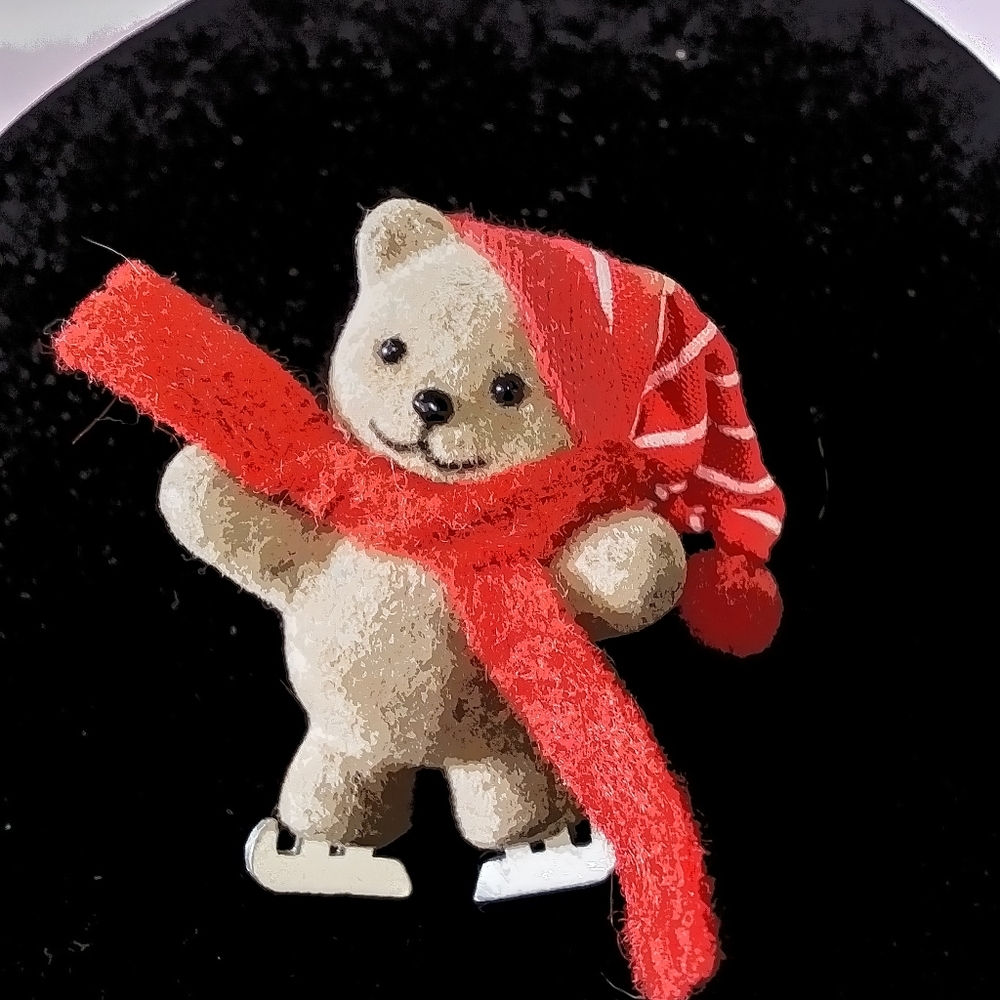 Teddy bear on ice skates pin.